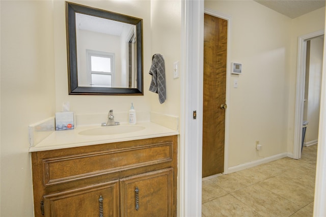 55 Flag Ct, Lake Jackson, TX 77566 - bathroom featuring vanity, tile patterned flooring, and baseboards