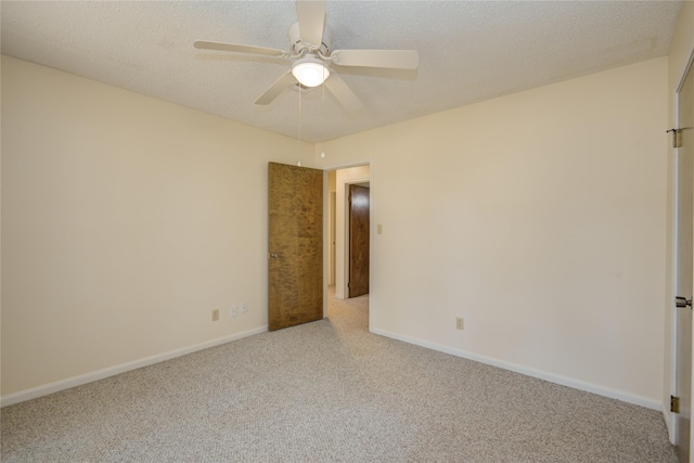 55 Flag Ct, Lake Jackson, TX 77566 - unfurnished bedroom featuring carpet flooring, baseboards, ceiling fan, and a textured ceiling