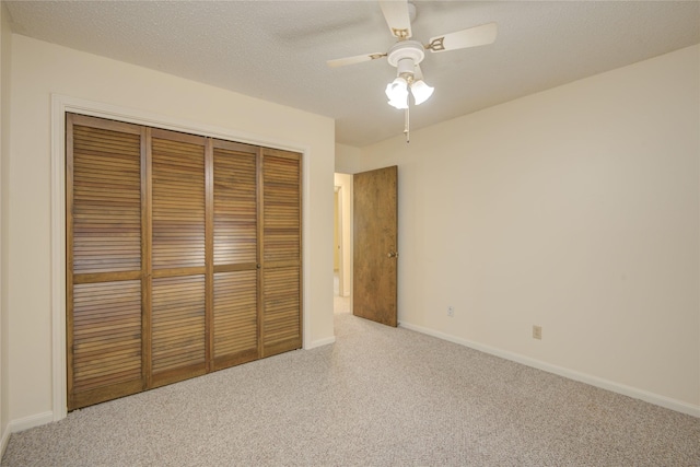 55 Flag Ct, Lake Jackson, TX 77566 - unfurnished bedroom with carpet flooring, a closet, baseboards, and a ceiling fan