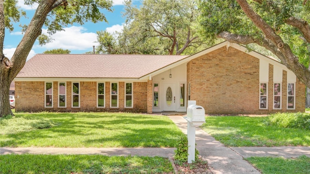 55 Flag Ct, Lake Jackson, TX 77566 - view of front of house featuring brick siding and a front lawn