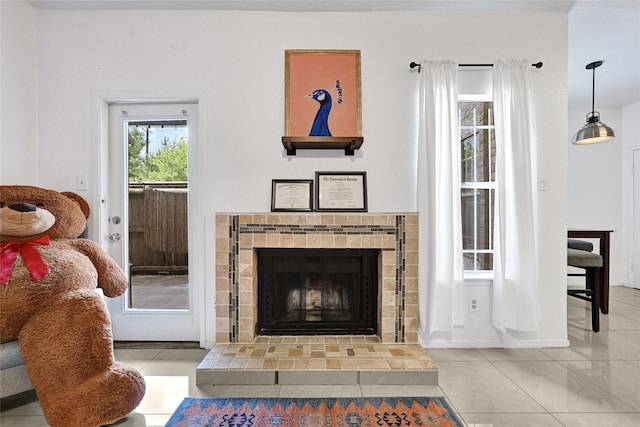 2011 Spenwick Dr Unit 415, Houston, TX 77055 - tiled living area featuring a tiled fireplace and baseboards