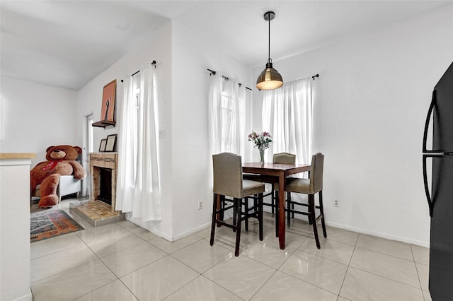 2011 Spenwick Dr Unit 415, Houston, TX 77055 - dining space featuring baseboards and light tile patterned floors