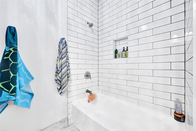 2011 Spenwick Dr Unit 415, Houston, TX 77055 - bathroom with marble finish flooring and tub / shower combination