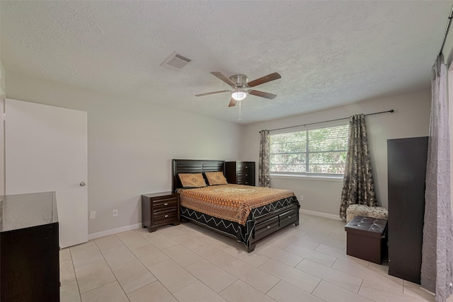10534 Towne Square Rd, Sugar Land, TX 77498 - bedroom with a textured ceiling, light tile patterned floors, a ceiling fan, and baseboards