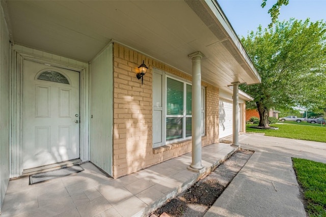 10534 Towne Square Rd, Sugar Land, TX 77498 - doorway to property featuring brick siding and covered porch