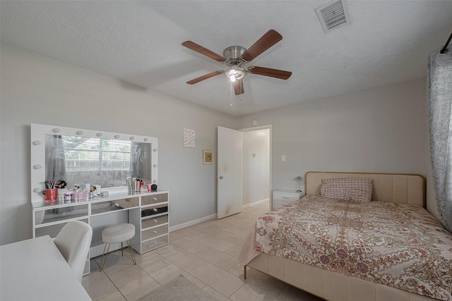 10534 Towne Square Rd, Sugar Land, TX 77498 - bedroom with light tile patterned flooring, a ceiling fan, a textured ceiling, and baseboards