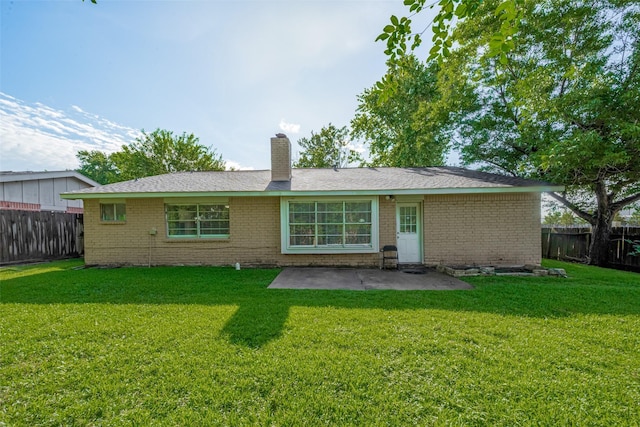 10534 Towne Square Rd, Sugar Land, TX 77498 - rear view of property with brick siding, a patio, and a chimney