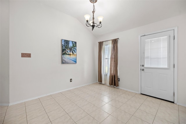 18206 Eton Ridge Ct, Richmond, TX 77407 - entryway with a chandelier, vaulted ceiling, light tile patterned floors, and baseboards