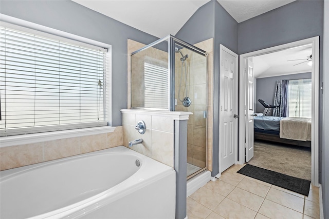 18206 Eton Ridge Ct, Richmond, TX 77407 - ensuite bathroom with a garden tub, a shower stall, tile patterned flooring, and a ceiling fan