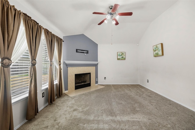 18206 Eton Ridge Ct, Richmond, TX 77407 - unfurnished living room featuring ceiling fan, carpet floors, plenty of natural light, a tile fireplace, and lofted ceiling