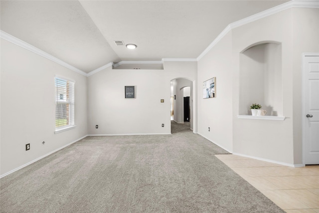 18206 Eton Ridge Ct, Richmond, TX 77407 - carpeted spare room with arched walkways, crown molding, lofted ceiling, baseboards, and tile patterned floors
