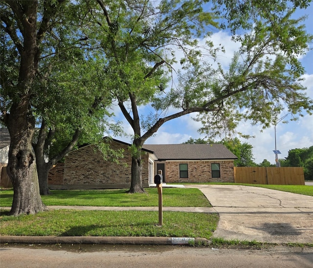 6502 Trail Valley Way, Houston, TX 77086 - view of front of property featuring concrete driveway, brick siding, and an attached garage