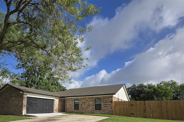 6502 Trail Valley Way, Houston, TX 77086 - ranch-style house with an attached garage, brick siding, and concrete driveway