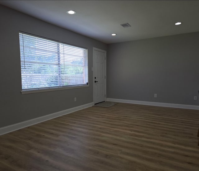 6502 Trail Valley Way, Houston, TX 77086 - spare room featuring dark wood finished floors, baseboards, and recessed lighting