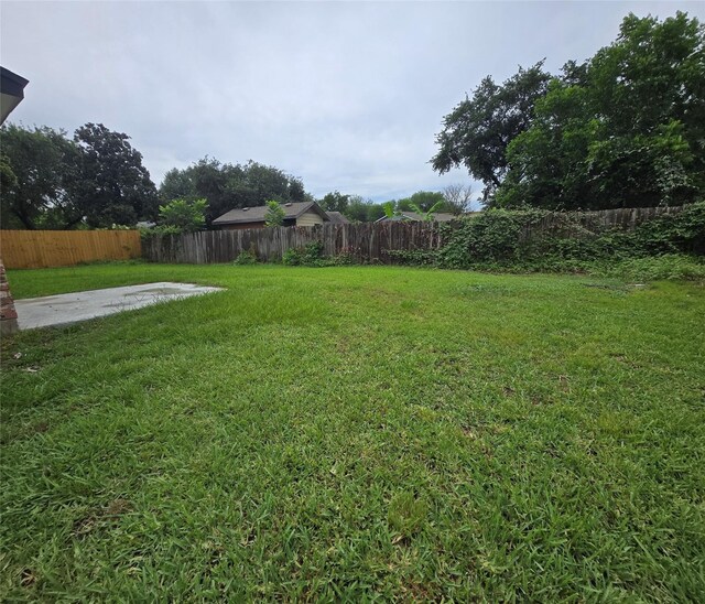 6502 Trail Valley Way, Houston, TX 77086 - fenced backyard with a patio area