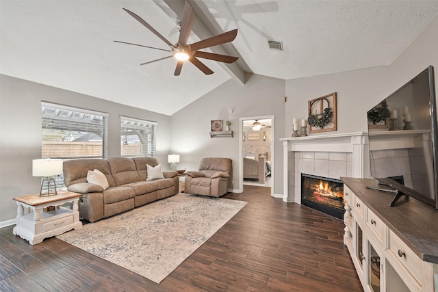 1912 Prairie Creek Dr, Pearland, TX 77581 - living room with a ceiling fan, a fireplace, dark wood-style floors, and baseboards