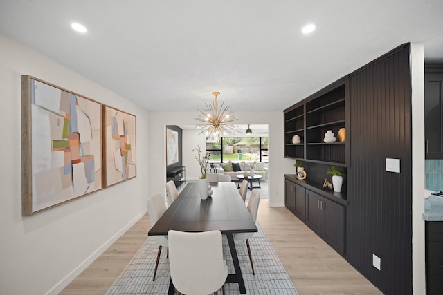4813 Hummingbird St, Houston, TX 77035 - dining room with a chandelier, light wood finished floors, and recessed lighting