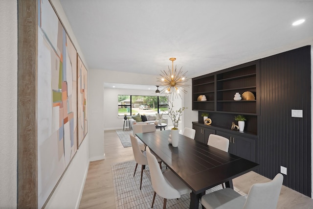 4813 Hummingbird St, Houston, TX 77035 - dining area with a chandelier and light wood-type flooring