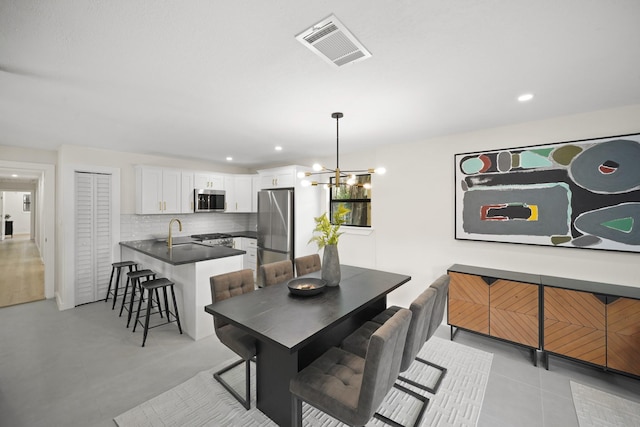 4813 Hummingbird St, Houston, TX 77035 - dining area featuring a chandelier and recessed lighting