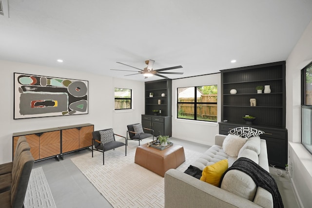4813 Hummingbird St, Houston, TX 77035 - tiled living room featuring ceiling fan, healthy amount of natural light, recessed lighting, and built in features