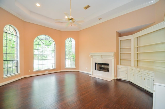 14403 Reissen Ln, Houston, TX 77069 - unfurnished living room with ceiling fan, dark wood-style flooring, a fireplace, crown molding, and a tray ceiling