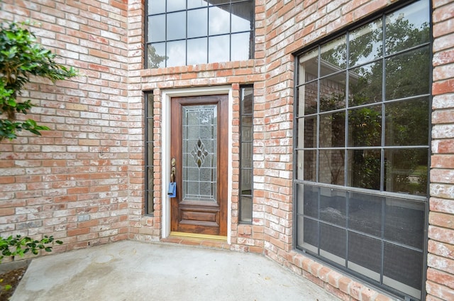 14403 Reissen Ln, Houston, TX 77069 - view of exterior entry featuring brick siding