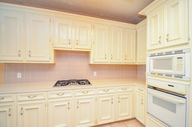 14403 Reissen Ln, Houston, TX 77069 - kitchen with white appliances, light countertops, and backsplash