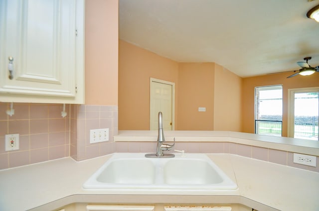 14403 Reissen Ln, Houston, TX 77069 - kitchen featuring a sink, light countertops, a ceiling fan, and white cabinets