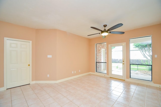 14403 Reissen Ln, Houston, TX 77069 - unfurnished room featuring a ceiling fan, baseboards, and light tile patterned floors
