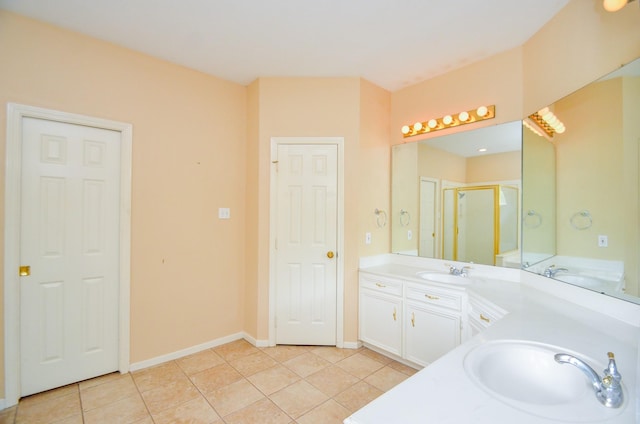 14403 Reissen Ln, Houston, TX 77069 - bathroom with double vanity, tile patterned flooring, a stall shower, and baseboards