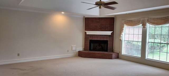 12214 3rd St, Santa Fe, TX 77510 - unfurnished living room featuring a ceiling fan, carpet, a brick fireplace, and ornamental molding