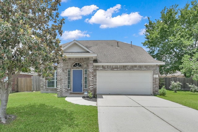 25819 Oakridge Forest Ln, Spring, TX 77386 - view of front of home with concrete driveway, an attached garage, a shingled roof, and stone siding