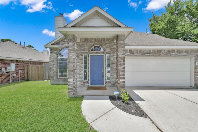 25819 Oakridge Forest Ln, Spring, TX 77386 - view of front of property featuring a garage, driveway, a chimney, a shingled roof, and brick siding