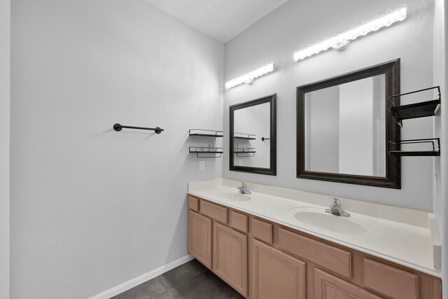 25819 Oakridge Forest Ln, Spring, TX 77386 - full bathroom with double vanity, baseboards, and tile patterned flooring