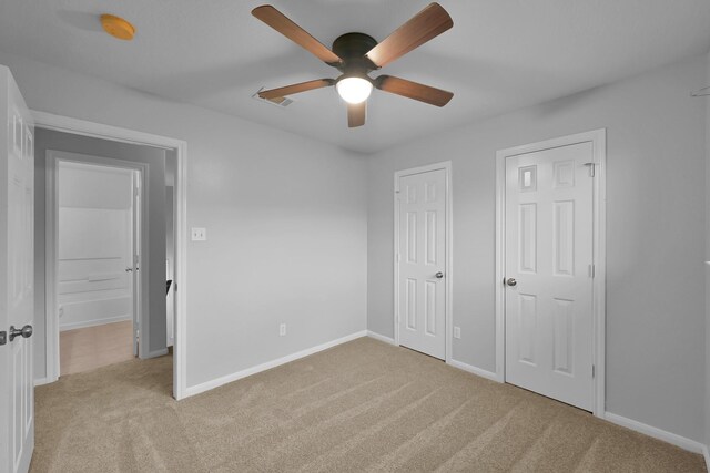 25819 Oakridge Forest Ln, Spring, TX 77386 - unfurnished bedroom featuring carpet, baseboards, and a ceiling fan