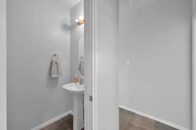 25819 Oakridge Forest Ln, Spring, TX 77386 - bathroom featuring baseboards and tile patterned floors