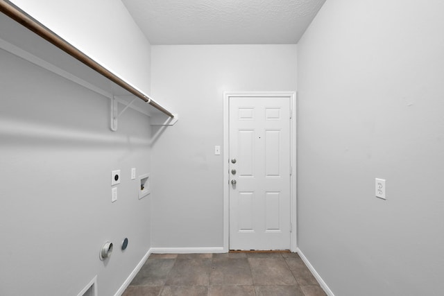 25819 Oakridge Forest Ln, Spring, TX 77386 - washroom featuring electric dryer hookup, baseboards, hookup for a washing machine, and a textured ceiling