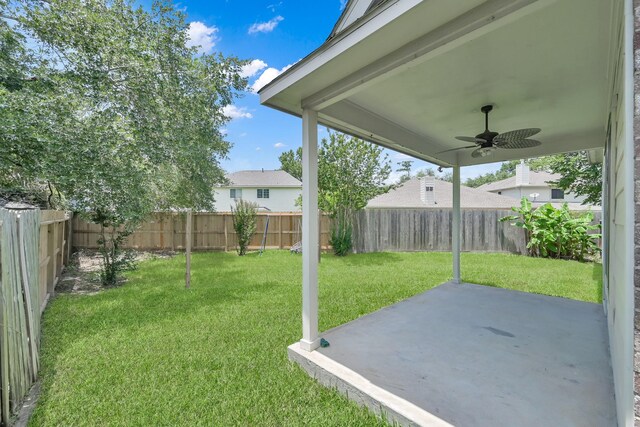 25819 Oakridge Forest Ln, Spring, TX 77386 - view of yard with a ceiling fan and a patio