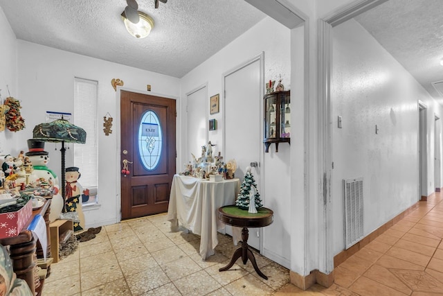 3405 E Circle Dr, Pearland, TX 77581 - foyer entrance with a textured ceiling and light tile patterned floors