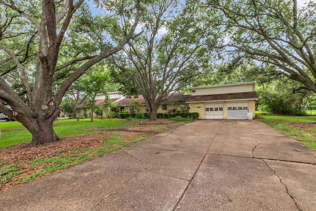 3405 E Circle Dr, Pearland, TX 77581 - view of front facade featuring an attached garage, a front lawn, concrete driveway, and stucco siding