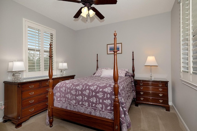 70 N Knights Crossing Dr, The Woodlands, TX 77382 - bedroom with light carpet, baseboards, and a ceiling fan