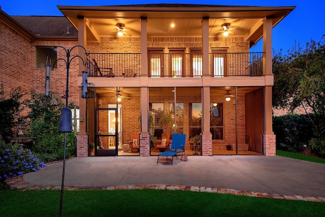 70 N Knights Crossing Dr, The Woodlands, TX 77382 - rear view of house with a balcony, a ceiling fan, and brick siding