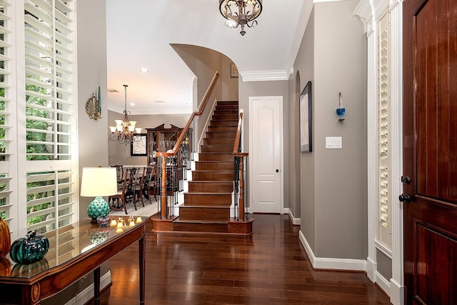 70 N Knights Crossing Dr, The Woodlands, TX 77382 - foyer featuring a chandelier, stairs, dark wood-type flooring, ornamental molding, and baseboards