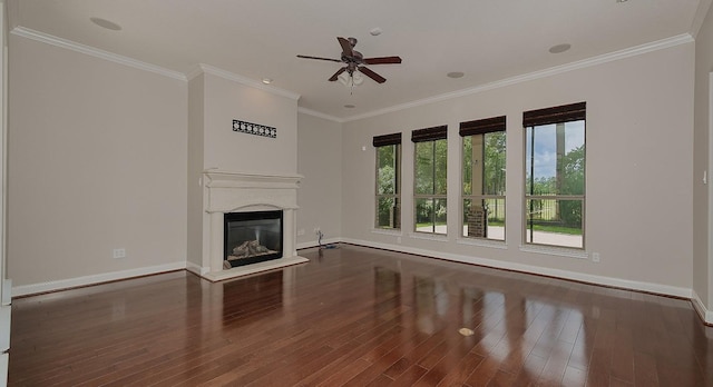 70 N Knights Crossing Dr, The Woodlands, TX 77382 - unfurnished living room with baseboards, ceiling fan, wood finished floors, a glass covered fireplace, and crown molding