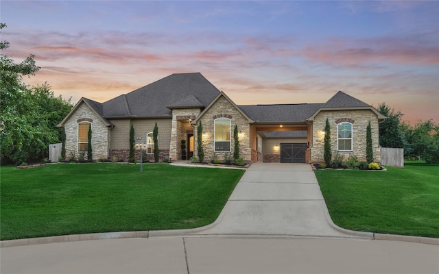 11 Hillsborough Dr E, Montgomery, TX 77356 - french country style house with stone siding, a front yard, concrete driveway, and a shingled roof