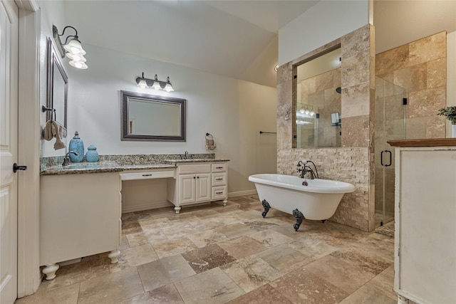 11 Hillsborough Dr E, Montgomery, TX 77356 - bathroom with stone tile flooring, vanity, a shower stall, a freestanding tub, and lofted ceiling
