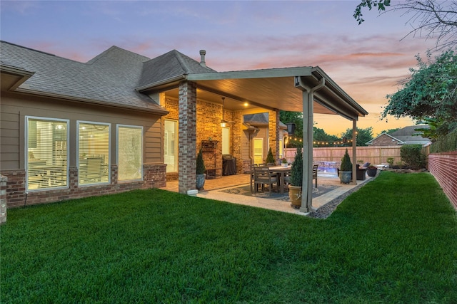 11 Hillsborough Dr E, Montgomery, TX 77356 - rear view of property featuring a patio area, a shingled roof, and brick siding