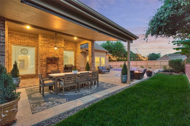 11 Hillsborough Dr E, Montgomery, TX 77356 - patio terrace at dusk featuring a patio area and outdoor dining area