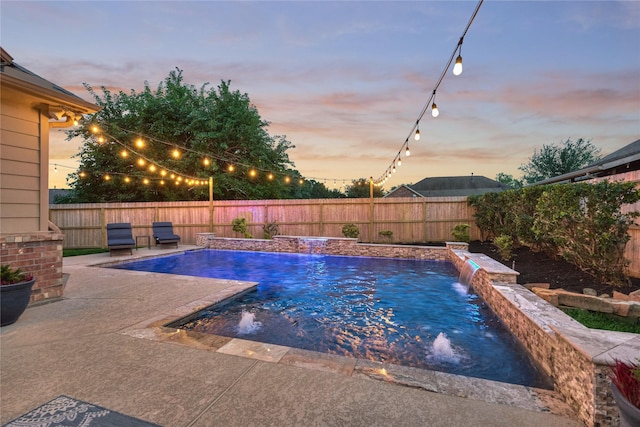 11 Hillsborough Dr E, Montgomery, TX 77356 - pool at dusk featuring a fenced backyard and a patio area