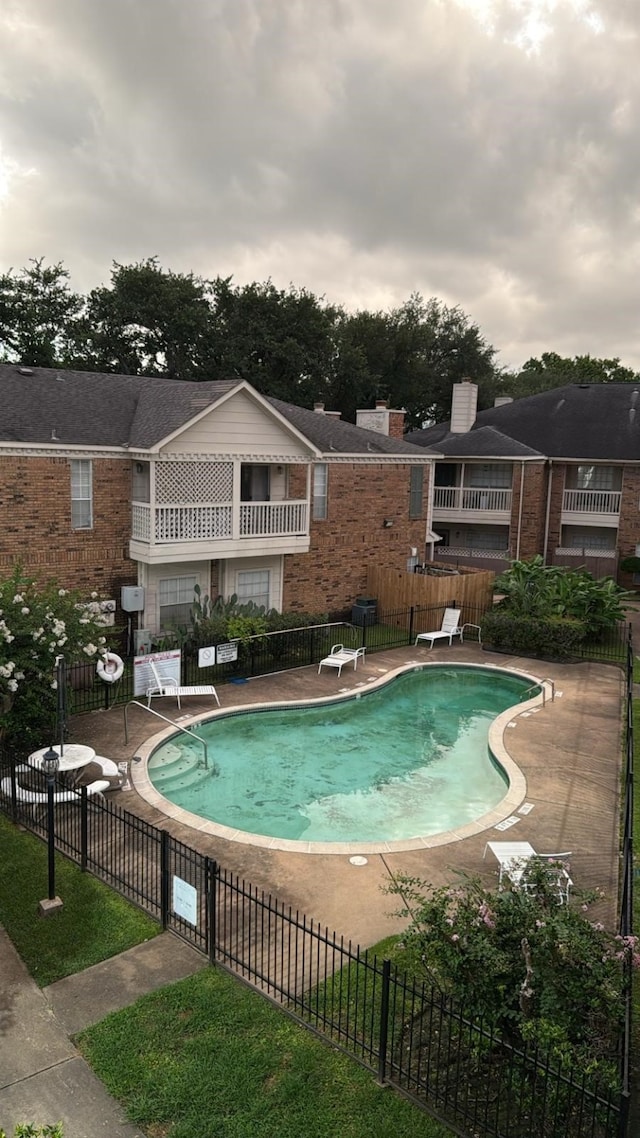 2626 Holly Hall St Unit 1014, Houston, TX 77054 - view of swimming pool featuring a diving board and a patio area
